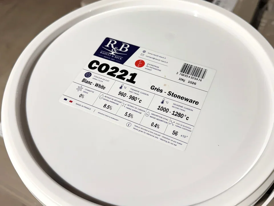 Close-up of the label on a CO221 white stoneware casting slip bucket