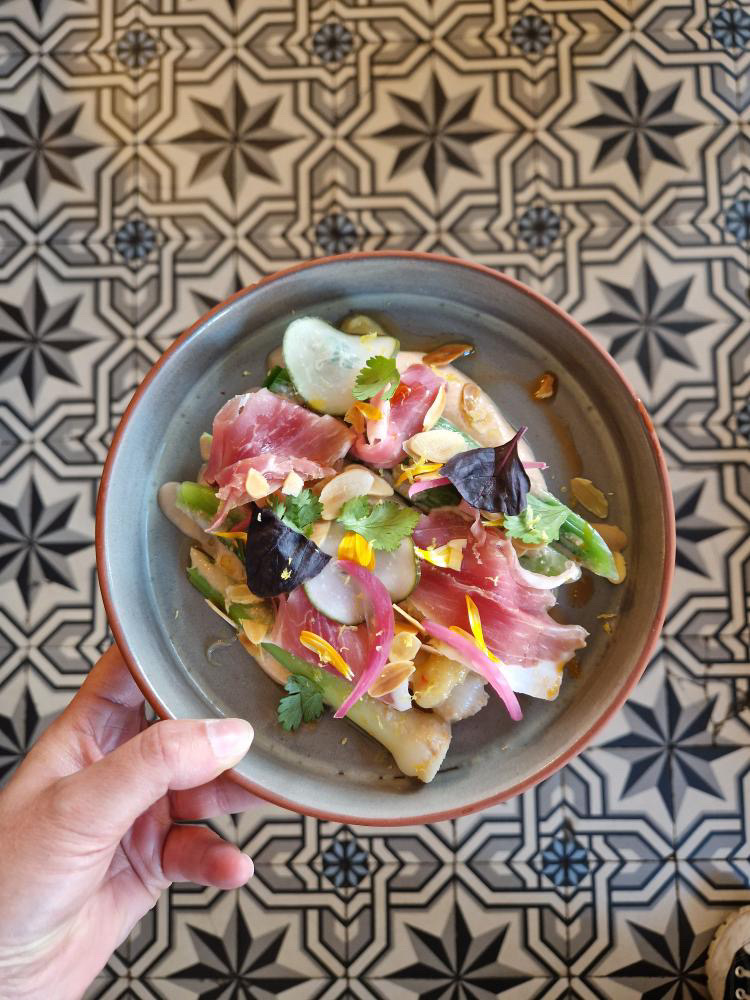 Plated food in a Noron Stoneware creation by Peter Potter in Touques