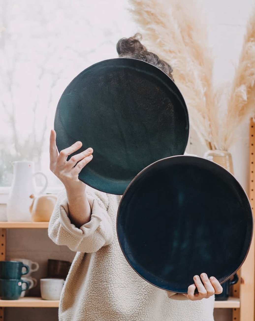 Gaëlle Le Doledec presenting two large Noron Stoneware platters