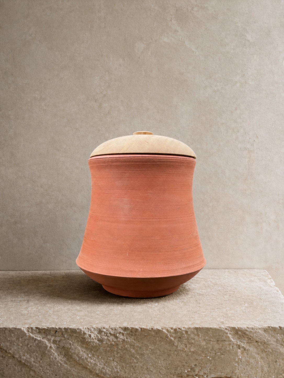 Wheel-thrown Noron Stoneware piece presented on a mineral plinth
