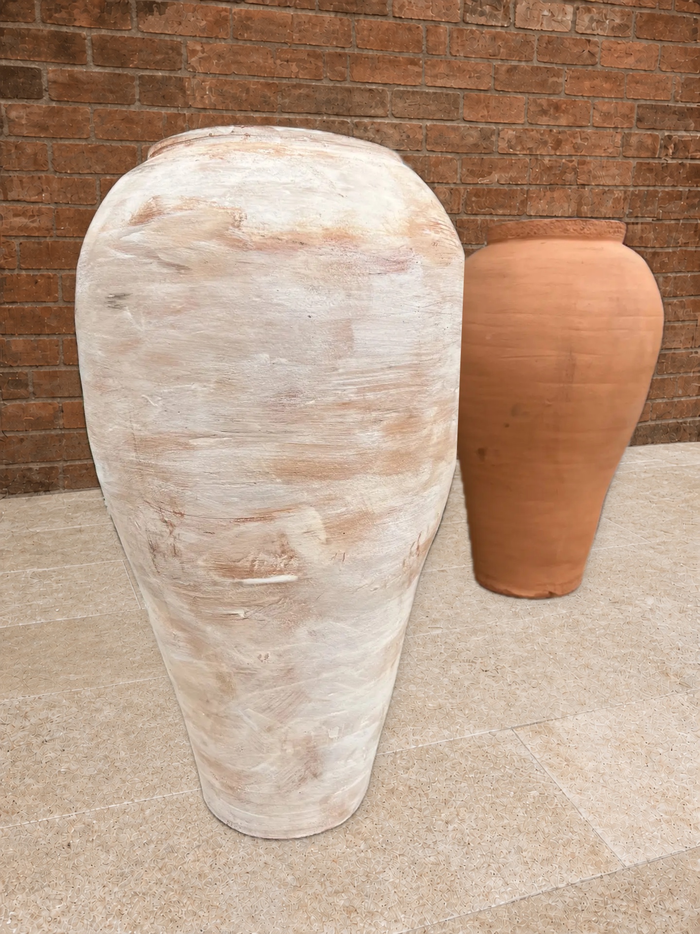 Two large workshop jars photographed outside the former Saon brickworks