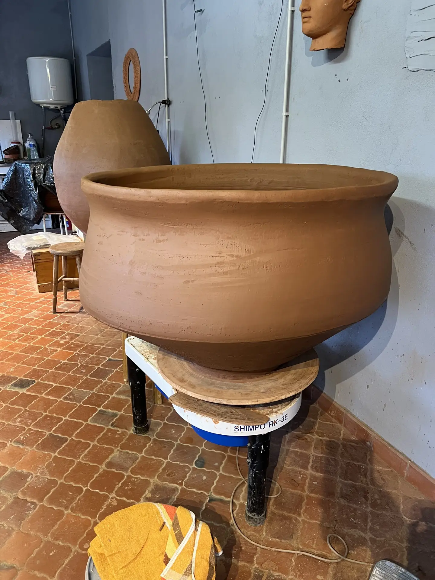 Large Noron Stoneware piece being formed on the wheel