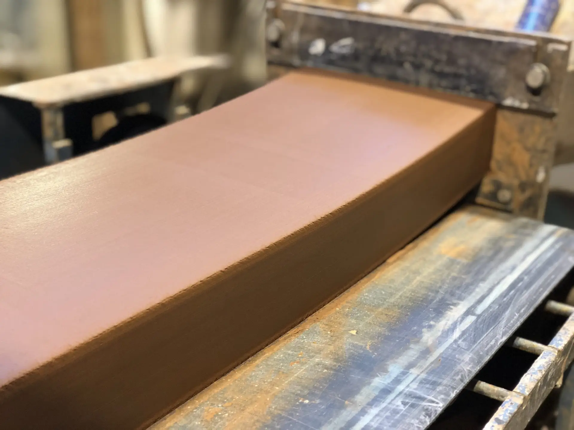Clay block photographed as it leaves the extruder